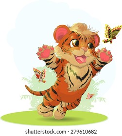 cub playing with butterflies in the meadow