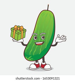 Cucumber cartoon mascot character with a box of gift