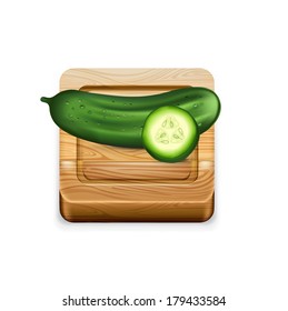 cucumber on wooden kitchen cutting board isolated