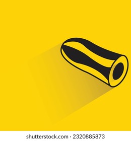 cucumber with shadow on yellow background