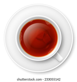 Cup of black tea with brown lump sugar