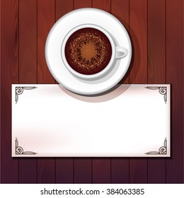 Cup of cappuccino with powder and card on wooden table