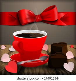 A cup of coffee with chocolate candy.