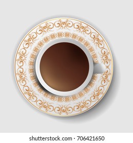 A cup of coffee with a decorative saucer