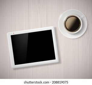 cup of coffee and a digital tablet on the table