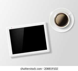 cup of coffee and a digital tablet on the table