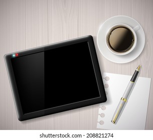 cup of coffee and a digital tablet on the table