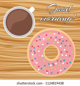 A cup of coffee with a donut on a wooden table with the inscription Good morning. View from above. Vector illustration.
