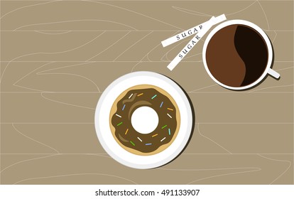 Cup of coffee and donut. View from above. Lunch.