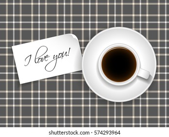 Cup of coffee with a note saying "I love you!"