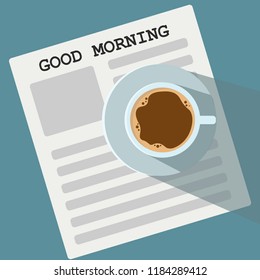 Cup of Coffee on a blue Background & Good Morning Text. Top View.