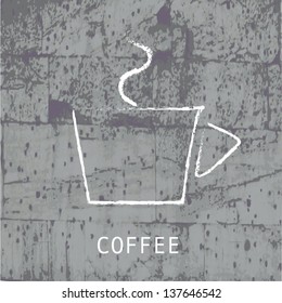 A cup of coffee on concrete wall.