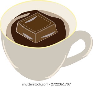 Una taza de café con un trozo de chocolate