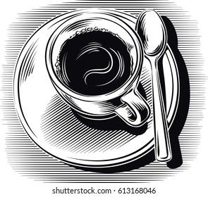 Cup of coffee with saucer and spoon.