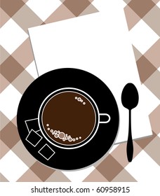 cup of coffee and spoon on table