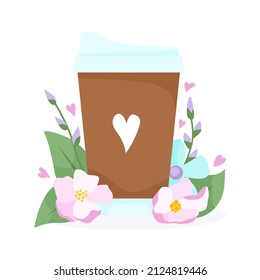 Una taza de café y flores de primavera a su alrededor. 