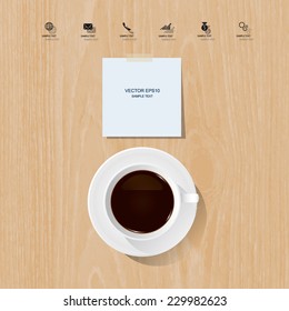 Cup of coffee and white paper stick on wooden background.