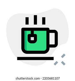 Cup containing warm water and tea bag.