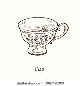 Cup with floral decor. Ink black and white drawing outline illustration