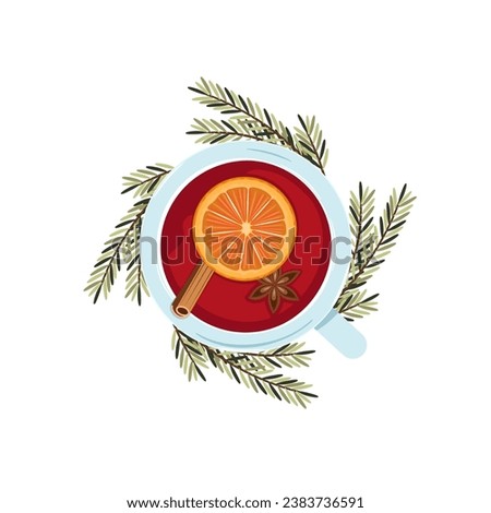 A cup of fragrant hot mulled wine with various spices. Top view.