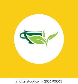 a cup of green tea leaves on a yellow background