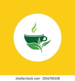 a cup of green tea leaves on a yellow background