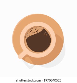A cup of hot black coffee without milk with coffee froth on top and bubbles, as well as a light beige cup that casts a shadow on the saucer