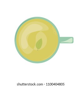 A cup of hot green tea with a leaf on the bottom