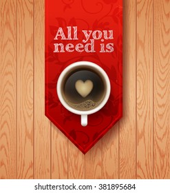 cup on a red ribbon on wooden vector background. drink with foam in the form of heart 