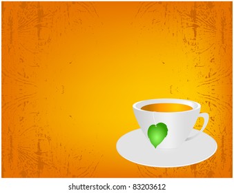 A cup of tea with green leaf located on an orange background grunge