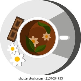 cup with tea with lemon, chamomile, chocolate, leaves on a saucer