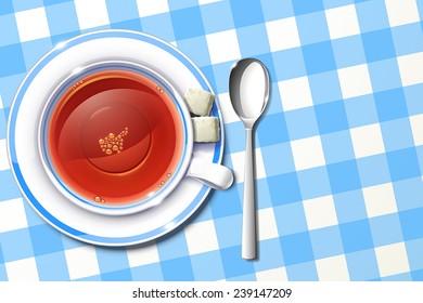 cup of tea on  blue tablecloth