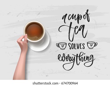 a cup of tea solves everything - Hand drawn calligraphy. hand with cup