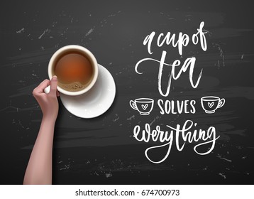 a cup of tea solves everything - Hand drawn calligraphy. hand with cup