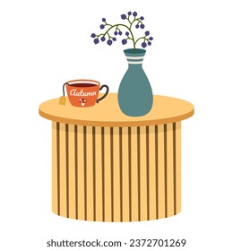 Cup of tea and vase with floral decor on wooden table against wh