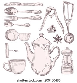 Una taza de té y utensilios de cocina vintage aislados en fondo blanco