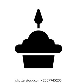 Cupcake with candle silhouette. Concept of celebration, birthday, and anniversary.