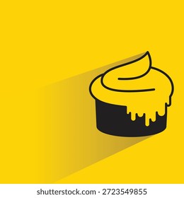 Icono de cupcake con fondo amarillo de sombra de gota