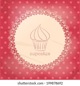 Cupcake on a doily label on polka dot background
