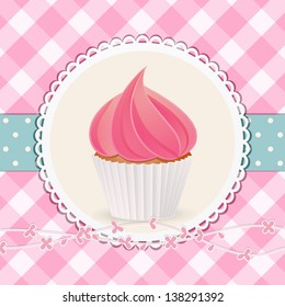 Cupcake with Pink Icing on a Circular Label against a Pink Gingham Background with Blue Ribbon