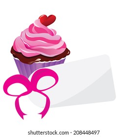 cupcake with a pink ribbon and a tag