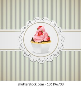 Cupcake width strawberries and pink creme on lace, vintage background.