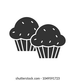 Cupcakes glyph icon. Muffins. Silhouette symbol. Negative space. Vector isolated illustration