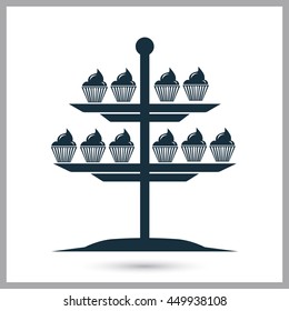 Cupcakes on a stand icon on the background