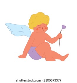 Cupid, the blond angel sits