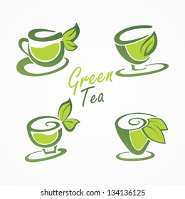 Cups tea and green leaves.