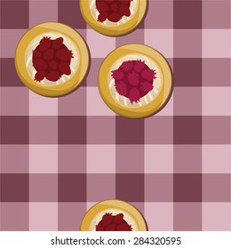 Curd and berry fruit on red checked background