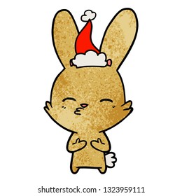 curious bunny hand drawn textured cartoon of a wearing santa hat