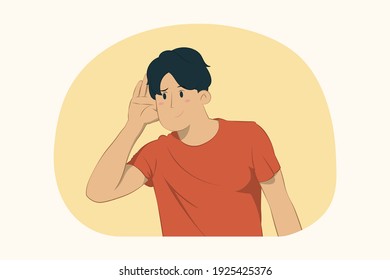 Curious young man try to hear you with hand near ear concept