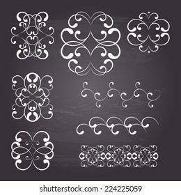 Curly design elements and monograms  in white color. Page decoration. Vector illustration. Isolated on chalkboard background.